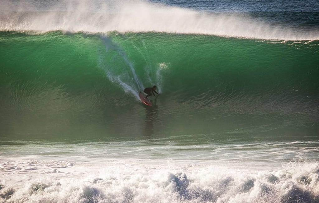 alex unwin surfing waves in Portugal